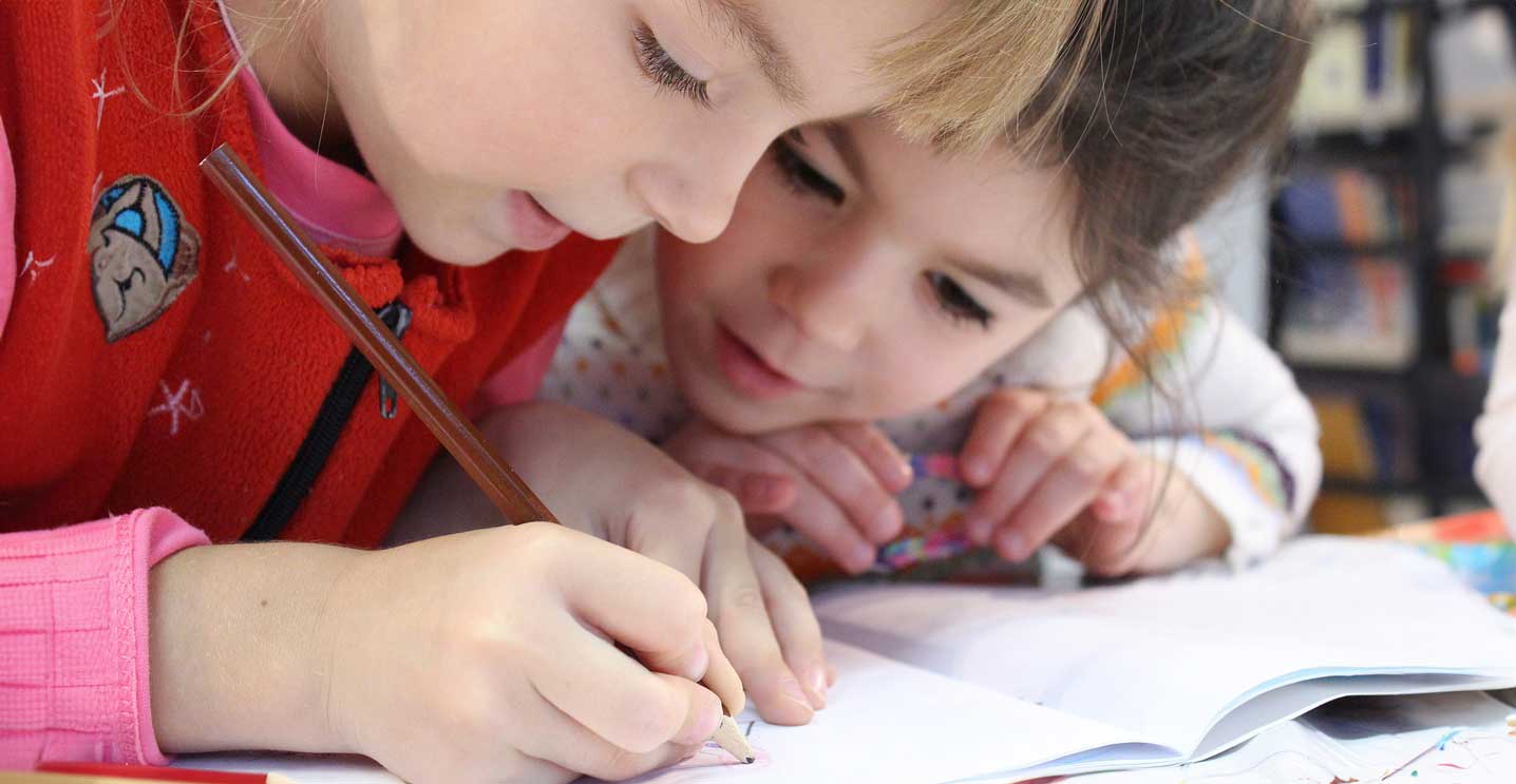 Two Children Studying